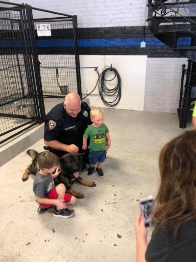 Police and K-9 with kids visiting