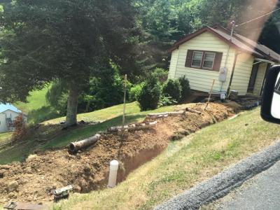 Pipe Laying Beside Open Ditch